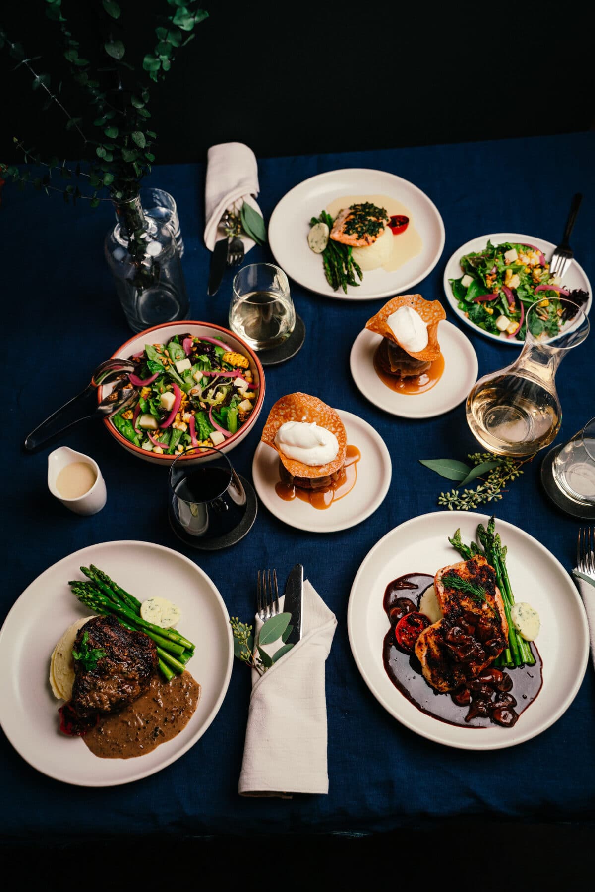 Saltlik's heat & serve 3-course meal for catering laid out on white plates.