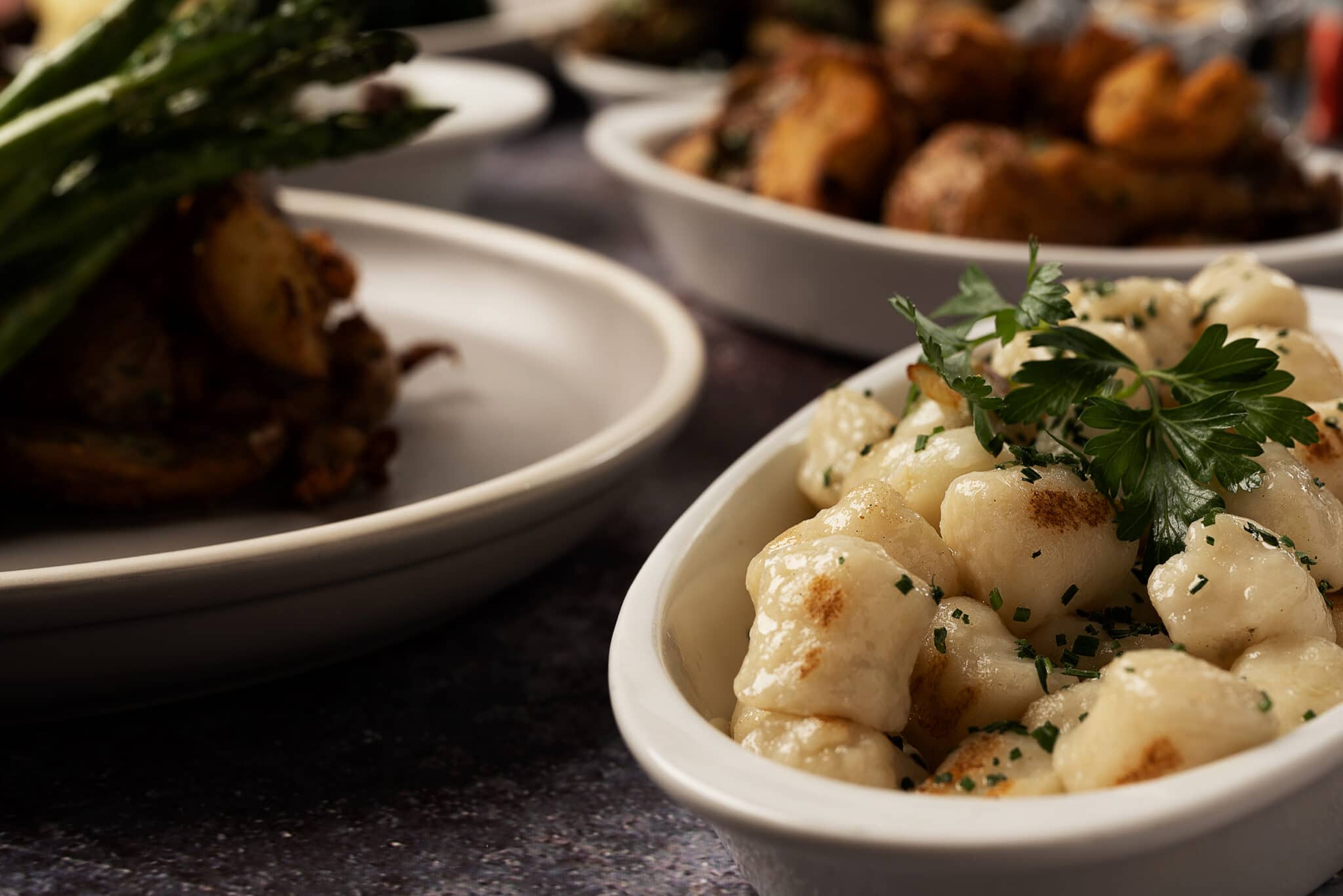 A few of Saltlik's menu items, with the Scallops in focus, and other blurred out in the background